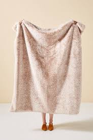 Anthropologie coren faux fur throw blanket, $128, available at anthropologie. Anthropologie Ashley Charit