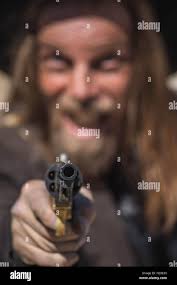 Gun points hi-res stock photography and images