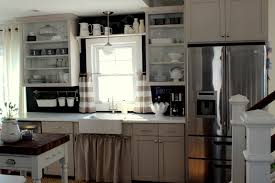 shelf, a backsplash, and cafe curtains