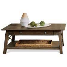 The top and bottom elliptical shaped panels have plenty of space to store. Riverside Furniture Helmsley Rustic Cocktail Table With Drawer Lindy S Furniture Company Cocktail Coffee Tables