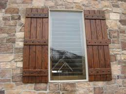 Tan Brick House With Dark Woodstained Shutters Google Search Shutters Exterior Wood Shutters Exterior Window Shutters Exterior
