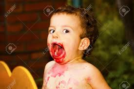 Like all male hairstyles, current haircuts for baby boys are an exciting mix of classic looks and trendy new ideas! Kid Having Fun Eating Cute Little Boy With Curly Hair Having Fun After Smelling His Face Weekend Warm And Cozy Scene In The Courtyard Of The House Stock Photo Picture And Royalty