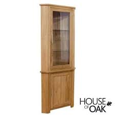 A bathroom cabinet has multiple shelves and drawers which help to keep the bathroom clean and organized. Opus Solid Oak Corner Display Cabinet House Of Oak