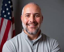 What could be causing the aggressive vibration in my 2003 Tahoe's driver's  floorboard after front end replacement?