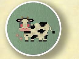 All you need to supply is the material, needle and thread. Moo Cross Stitch Pattern Sweet Cow Amongst Flowers Modern Etsy In 2021 Cross Stitch Cow Simple Cross Stitch Cross Stitch Animals