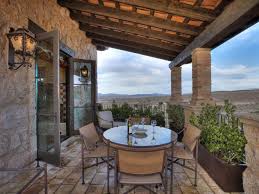 By bobvila.com on 7 may 2020. Defining Elements Of Spanish Style Design Wrought Iron Light Fixtures Illuminaries Lighting
