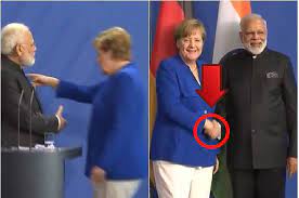 Angela merkel asked president trump to shake hands. This Body Language Theory Explains Why Merkel Leaves Modi S Handshakes Hanging