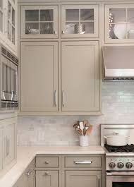 Neutral Painted Cabinets Gray Greige Taupe And Gray Greens Offer A Nice Change To The Stark White Kitch Kitchen Trends Taupe Kitchen Taupe Kitchen Cabinets