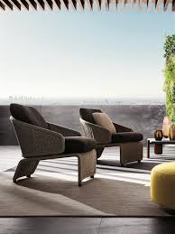 Belt upholstered armchairs furnish outdoor spaces as islands of relaxation. Halley Outdoor Armchairs En