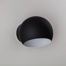 Tüllmann design reminiscent of our deuce wall sconce but single in glow. Wall Sconce Ameico