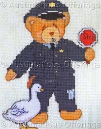 This listing includes two cross stitch patterns. Rare Priscilla Hillman Cherished Teddies Police Officer Counted Cross Stitch Kit
