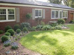 The Typical Red Brick Ranch Ranch Style Homes Ranch Landscaping Ideas Brick Ranch Houses