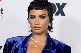 She always looks fashion forward. Demi Lovato S Pitch Black Pixie Cut And Baby Bangs Are Back See Photos Allure