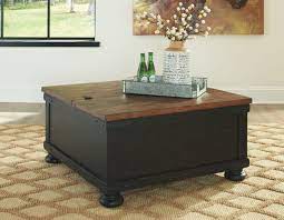 Clever split style design pairs a spring lift top with hinged lid revealing a handy storage compartment. Ashley Valebeck Black Brown Square Lift Top Cocktail Table On Sale At Bargains And Buyouts Serving Tri County West Chester And Winton Woods In Cincinnati Oh