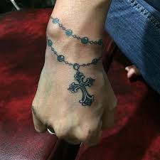 Rosaries are usually coupled with cross and they can be perfect tattoos to represent your spiritual tendency. Pin On Small Cross Tattoo