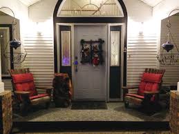 A christmas tree with gold ornaments, pinecones, snowflakes in a basket is a lovely rustic decoration for your porch. Decorating Outside For Christmas 7 Great Tips From Duradek