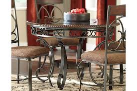 The space required for guests to get in and out of their seats. Glambrey Dining Table Ashley Furniture Homestore In 2021 Round Dining Room Table Metal Dining Room Table Round Dining Room