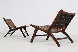 With rich traditional styling, this stationary wicker lounge chair from the beacon park collection adds sophistication to your outdoor living space. Pair Of Solid Balinese Teak And Cognac Leather Lounge Chairs Brazilian Style For Sale At 1stdibs