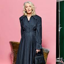 The most beautiful woman beautiful 50+ woman posing in studio in front of grey background. Meet Oldushka The Modeling Agency For Older People Vogue