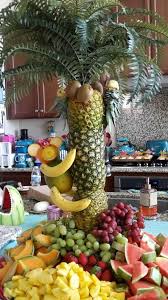 This edible arrangement centerpiece is perfect for kids or adults hawaiian parties. My Pineapple Tree Fruit Platter Centerpiece With Fruit Monkey And Pineapple Parrots Fruit Platter Ideas Party Fruit Party Pineapple Palm Tree