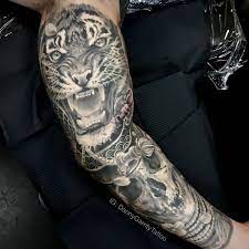 The tattoos are not only adorable but also express an intricate piece of artwork given the complexity of the design and the large size. Tiger And Skull Japanese Theme Sleeve In 2021 Japanese Sleeve Realism Tattoo New Tattoos