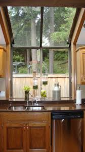 Window treatments serve as pretty accents in the kitchen. Small Kitchen Designs With Window Novocom Top