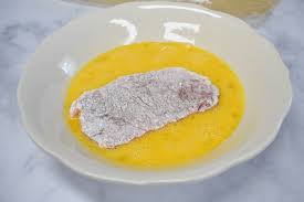 Place flour in a shallow bowl, beat eggs in a second shallow bowl and mix bead crumbs, cheese, garlic powder, onion powder and dried parsley in the third shallow bowl. Fried Pork Chops Cook2eatwell