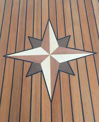 The table top is 4mm thick teak plank with marine black caulking stripes in between. Tischlerei Kurt Behn Kg Maritimo Table