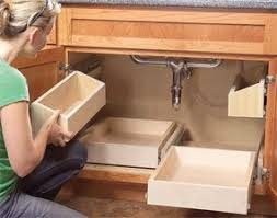 Give your kitchen an updated look by installing new cabinets or repairing damaged ones! From The Family Handyman How To Build Kitchen Sink Storage Trays On Likaty Kitchen Sink Storage Sink Storage Home Diy