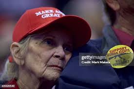 Mary Strohmeyer reaches towards handmade Donald Trump campaign pins... News  Photo