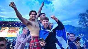 Pictured is a wide view of scottish fans on the pitch In Pictures Scotland Fans Celebrate England Result Bbc News