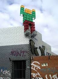 Project Crate Man In The Streets Of Melbourne Australia Made From Used Milk Cartons Is Covering Fence Street Art Street Art Melbourne Urban Art Graffiti