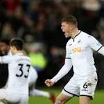 Battling Swansea shock Liverpool