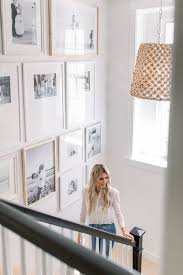 Black And White Gallery Wall Stairs Staircase Gallery Wall Featuring A Mix Of Neutral Colours White And Wood And Black And White Portrait Gallery Wall Staircase Hallway Gallery Wall Gallery Wall