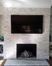 Fires and wood burners tend to give off a warm glow, which would really help to accentuate the texture on your tiles; Top 60 Best Fireplace Tile Ideas Luxury Interior Designs