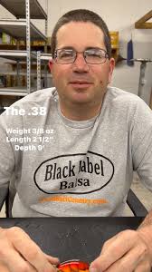 John Hott Lures Petite Petee WWW.WOODBAITCOUNTRY.COM A flat sided body with  a thumbnail circuit board bill and the line tie comes through the bill.  Tight swimming action, which is ideal for cold