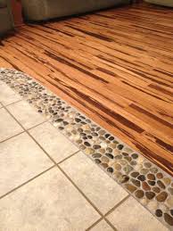 River Rock In Between Wood And Tile Floors Between The Kitchen Living Room And Maybe Even Dining Area And Den D Flooring Transition Flooring Bamboo Flooring