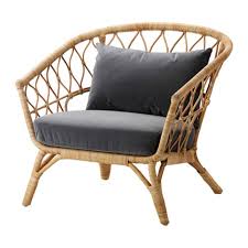 A neutral moroccan bedroom with moroccan pillows and a fringe blanket, pampas grass, feather and bead decor. Ikea Bohemian Look Best Home Decor Products Apartment Therapy