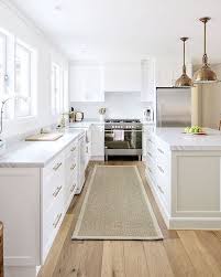 Sisal Runner White Kitchen With Carrara Marble Brass Accents Oak Floors Shiplap Walls By Cottonwood Interi Kitchen Design Kitchen Interior Kitchen Flooring