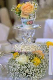 Wedding Favors Are As Ancient A Custom As Weddings Themselves As Simple As Sweets Or As Tea Party Centerpieces Bridal Party Table Decorations Wedding Tea Cups