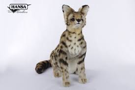 In a biome largely dominated by packs, one animal stands alone, and tall. 7373 African Serval Cat Sitting 44cm L Hansa Creation Inc
