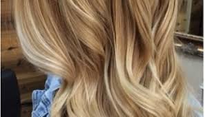 Try a glossy pink lip and a smokey eye for a makeup look that'll still pop against a warmer hair color. Mane Interest Dark Honey Highlights