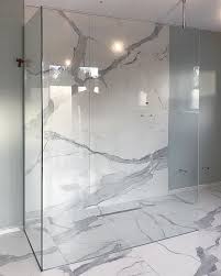 Most porcelain tile measures 12 inches or larger, which produces a contemporary look for a shower but requires extra steps during installation to prevent lippage. Getting There Glass Shower Enclosure Installed With A Combination Of Large Format Poli Bathroom Decor Luxury Small Bathroom Remodel Designs Beautiful Bathrooms