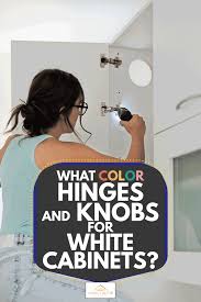 A stainless steel range hood is fixed to white subway backsplash tiles lined with light gray grout and is. What Color Hinges And Knobs For White Cabinets Home Decor Bliss