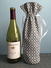 Pin pattern to fabric and cut out 2 pieces. Wine Bottle Gift Bag Tutorial The Kim Six Fix