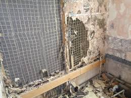 Water leaks can cause the drywall behind the shower's surround to deteriorate, requiring you to remove the surround and install a new wall. Old Bathroom With Damp Walls Modernised And Refitted