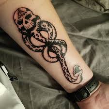 The symbol of a snake emerging from the mouth of a skull is downright heavy metal and it will unite you with other death eaters around the world. My Harry Potter Dark Mark Tattoo That I Ve Been Wanting For Years X Post From R Harrypotter Japanese Tattoo Sl Dark Mark Tattoos Mark Tattoo Tattoos For Guys