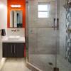 The wooden vanity countertop runs straight on as bathtub panelling and continues all the way up the wall. 1