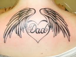 Tattoos with names | name with wings and halo lower back. 30 Lovely Heart With Wings Tattoo Designs Creativefan