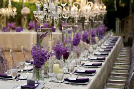 Crystal Chandeliers And Beautiful Purple Centerpieces Flower Centerpieces Wedding Purple Table Settings Purple Centerpieces